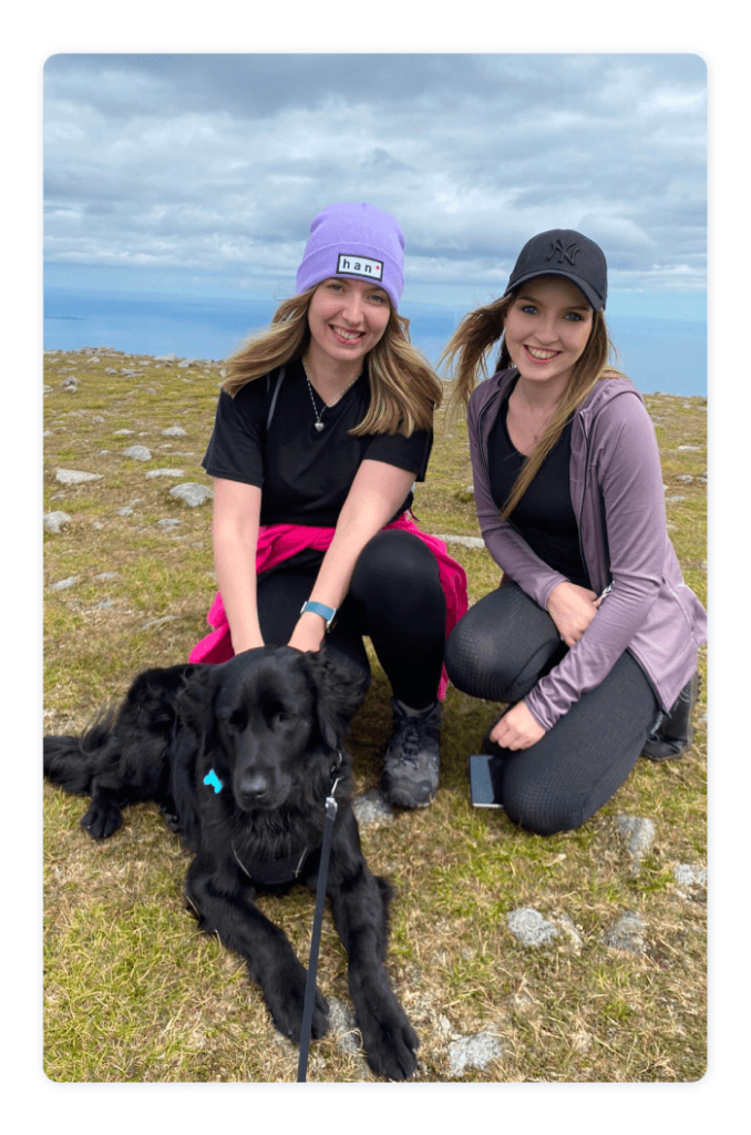 Astrid outdoors with a friend and dog