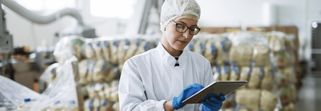 Digital Transformation has taken place - A woman using digital technology in food manufacturing 